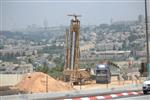 People and machines build and renovate the paths the capital city - Jerusalem