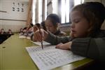 Children learn to read letters of the alphabet