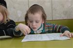 Children learn to read letters of the alphabet