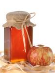 דבש בצנצנת עם תפוח אדומה