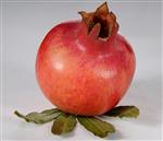 a fresh pomegranate on a white background