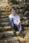  Boy sits on stairs