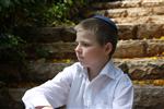  Boy sits on stairs