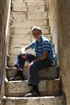  Boy sits on stairs