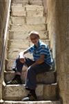  Boy sits on stairs