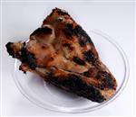 a chicken wing for seder night on a white background