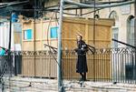 Jews build a sukkah streets of Jerusalem