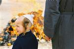 Father and son burn chametz on Passover eve