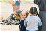 Father and son burn chametz on Passover eve