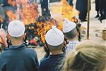 Father and son burn chametz on Passover eve