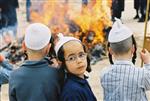 Father and son burn chametz on Passover eve