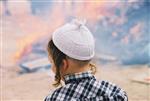 Father and son burn chametz on Passover eve