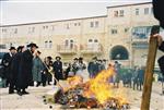 Father and son burn chametz on Passover eve