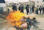 Father and son burn chametz on Passover eve