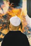 Father and son burn chametz on Passover eve