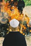 Father and son burn chametz on Passover eve