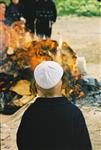 Father and son burn chametz on Passover eve