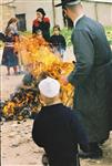 Father and son burn chametz on Passover eve