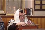 Jews praying in the synagogue with prayer shawl and phylacteries