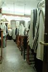 Jews praying in the synagogue with prayer shawl and phylacteries