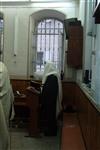 Jews praying in the synagogue with prayer shawl and phylacteries