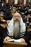 Jews praying in the synagogue with prayer shawl and phylacteries