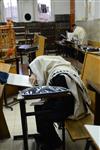 Jews praying in the synagogue with prayer shawl and phylacteries