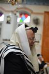 Jews praying in the synagogue with prayer shawl and phylacteries