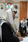 Jews praying in the synagogue with prayer shawl and phylacteries