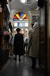 Jews praying in the synagogue with prayer shawl and phylacteries