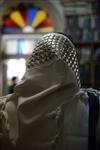 Jews praying in the synagogue with prayer shawl and phylacteries