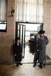 Jews praying in the synagogue with prayer shawl and phylacteries