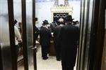 Jews praying in the synagogue with prayer shawl and phylacteries