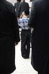 Jews praying in the synagogue with prayer shawl and phylacteries