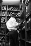 הספרייה של אוצר הספרים המלאה באלפי ספרי קודש ובחור מעיין שם בספר &#160;