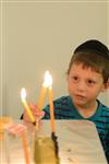 Lighting Hanukkah candles