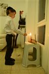 Lighting Hanukkah candles