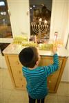 Lighting Hanukkah candles