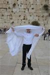 Talit and Tefilin Laying against the background the Western Wall in Jerusalem