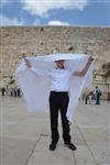 Talit and Tefilin Laying against the background the Western Wall in Jerusalem