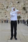 Talit and Tefilin Laying against the background the Western Wall in Jerusalem