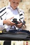 Talit and Tefilin Laying against the background the Western Wall in Jerusalem