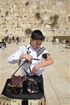 Talit and Tefilin Laying against the background the Western Wall in Jerusalem