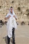 Talit and Tefilin Laying against the background the Western Wall in Jerusalem