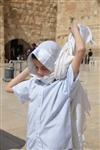 Talit and Tefilin Laying against the background the Western Wall in Jerusalem