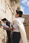 Talit and Tefilin Laying against the background the Western Wall in Jerusalem