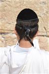 Talit and Tefilin Laying against the background the Western Wall in Jerusalem