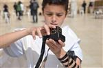 Talit and Tefilin Laying against the background the Western Wall in Jerusalem