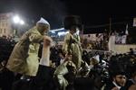 Light and dancing around Lag Ba&#39;Omer bonfire