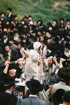 Light and dancing around Lag Ba&#39;Omer bonfire